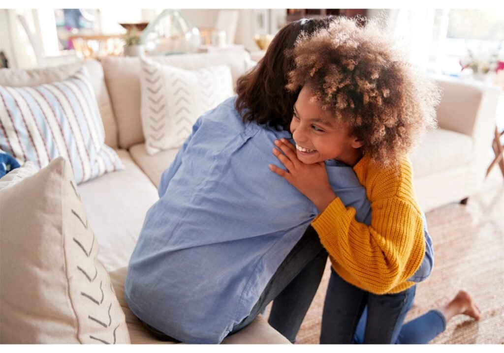 Two young people relaxing together on a sofa at home